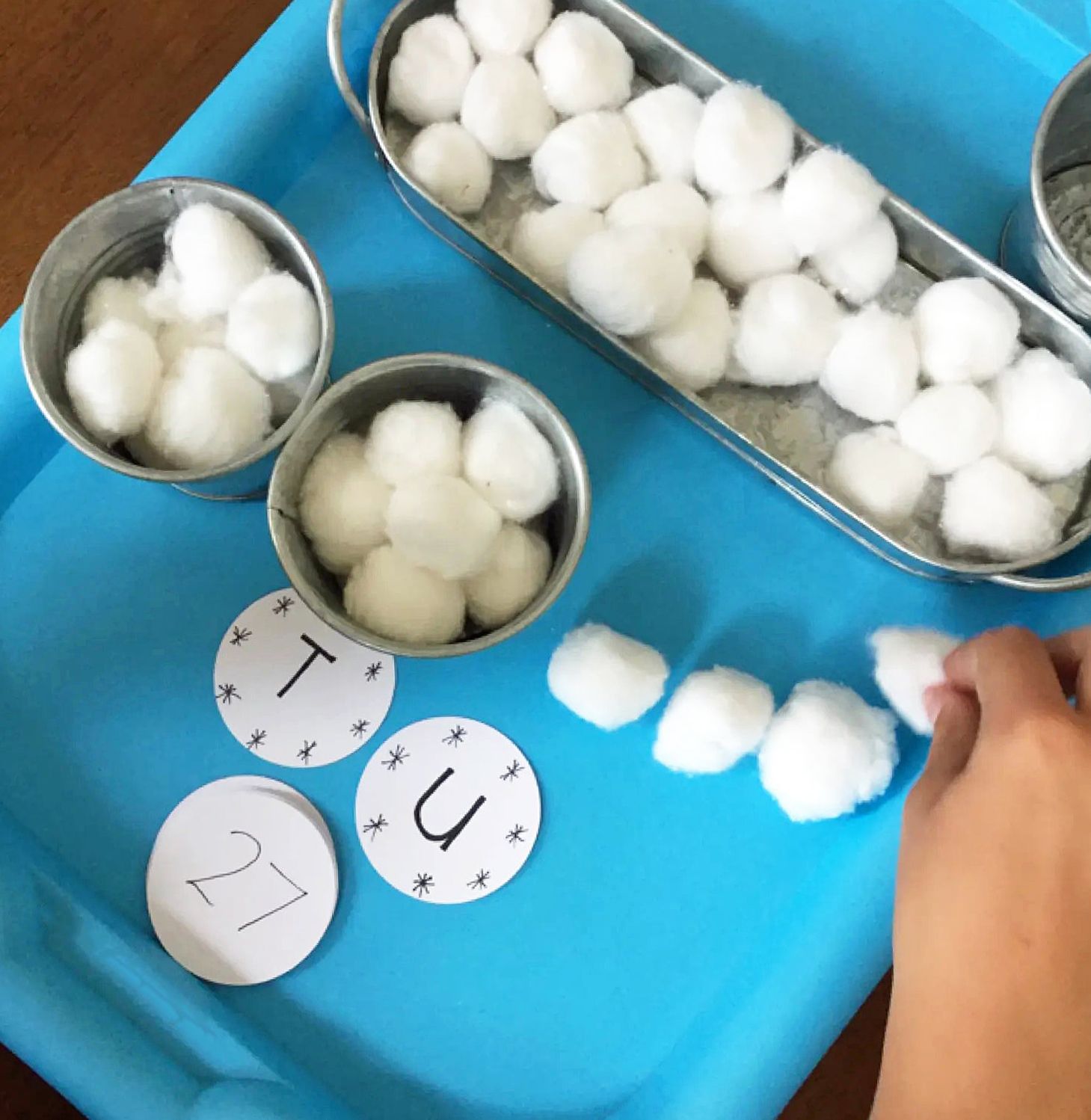 Ten snowballs and a bucket